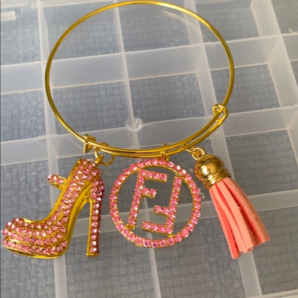 Gold plated bangle with charms